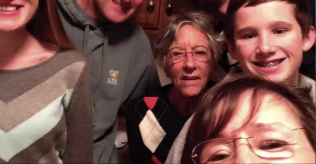 Charter Senior Living of Hasmer Lake Video Thumbnail Family Group Surrounded by senior living resident